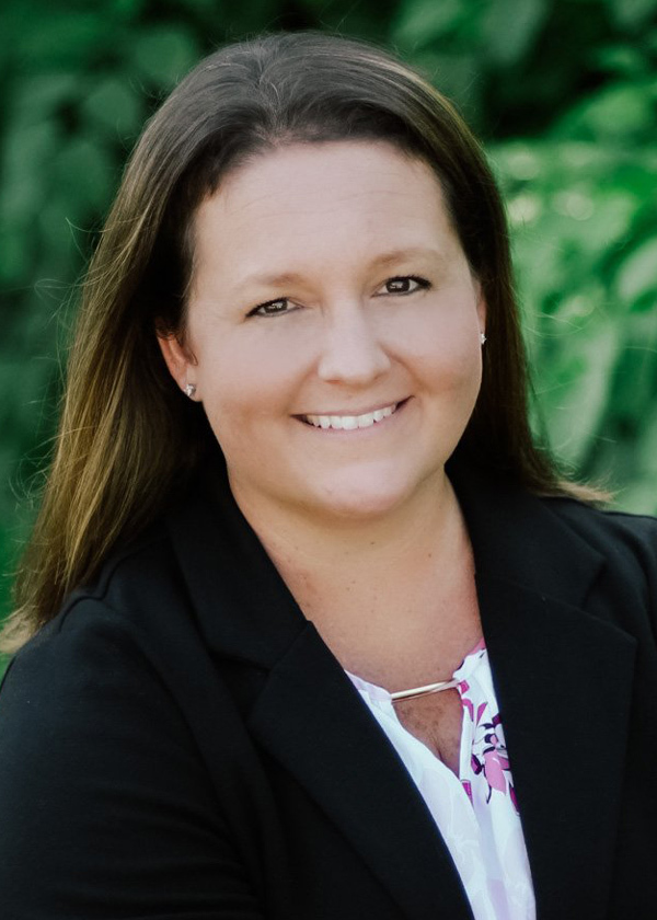 Headshot of Executive Director Stormy Parsons smiling confidently.